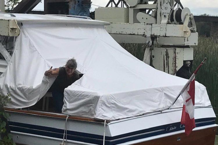 person doing a thumbs up on a boat