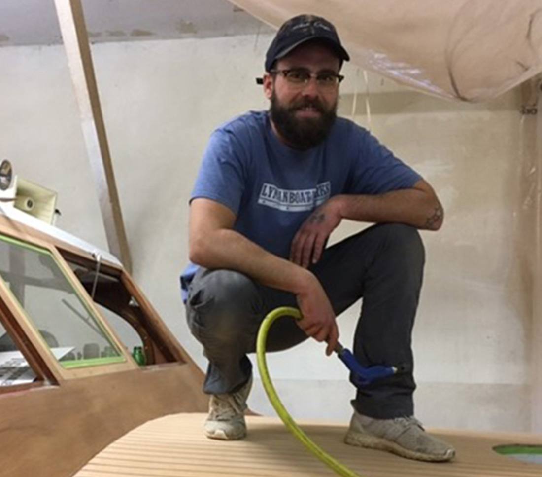 sirens boatworks employee smiling