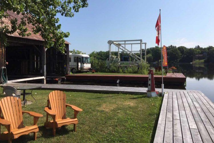 boat marina with chairs on the dock