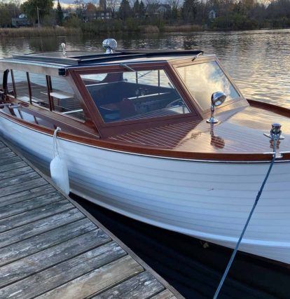 Skipper boat in the water tied to a dock