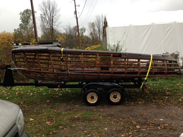 wooden boat frame on a trailer