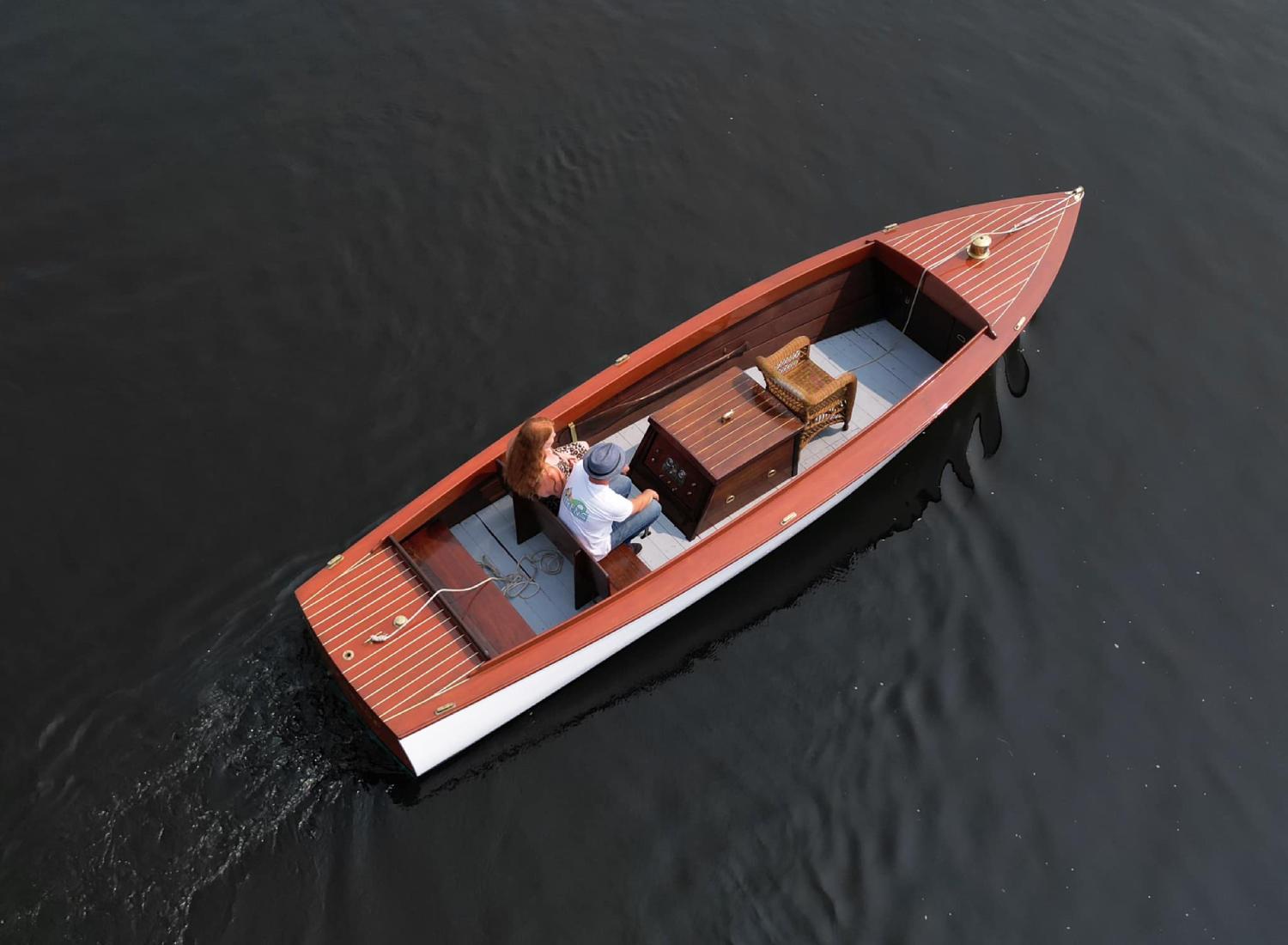 Man and women riding on a boat in calm water